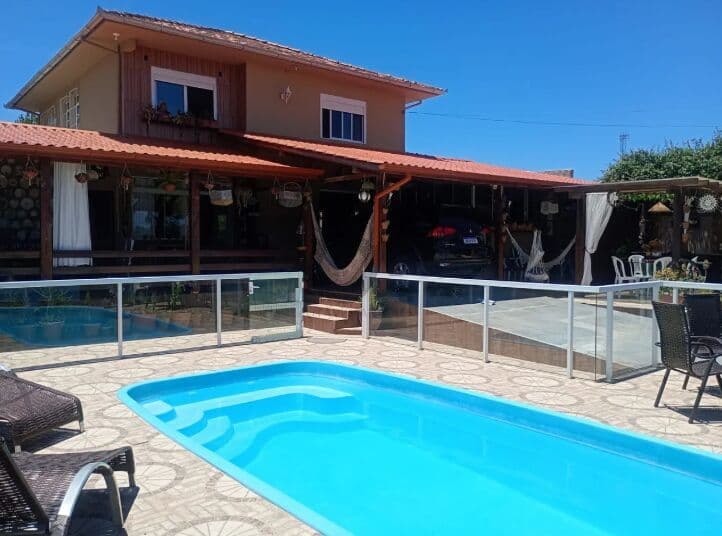 Foto de Casa Aconchegante 4 Quartos 220 m² com Piscina + Cascata | Pinheira, Palhoça/SC